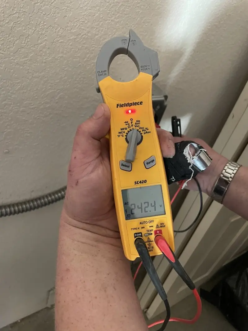 Voltage testing with clamp meter during Circuit Breaker Repair in Manassas Park